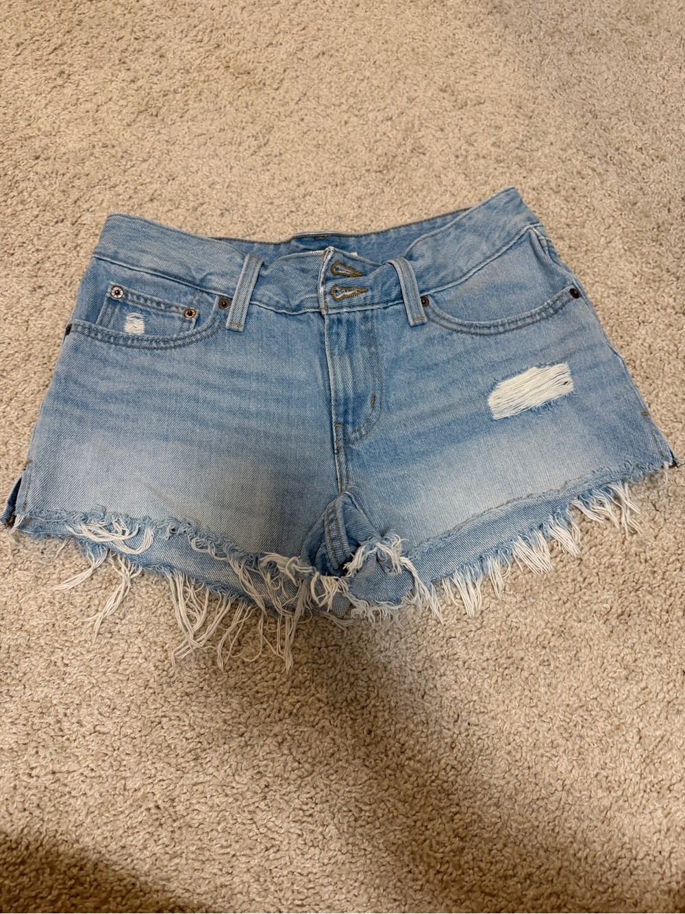 Levi’s Light Wash Denim Frayed Hem Shorts